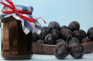 jar of plum jam and some sweet plums